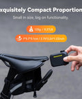 On-The-Go Mini Bike Pump With Gauge next to a bicycle seat, showcasing its ultra-compact size and portability.