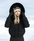 Woman wearing Women's Waterproof Ski Jacket With Windproof Dope Warmth Snowboard Style Snow Coat Short Slim Fit For Hiking All Weather Winter Gear For Cold Slopes And Trails in snowy landscape