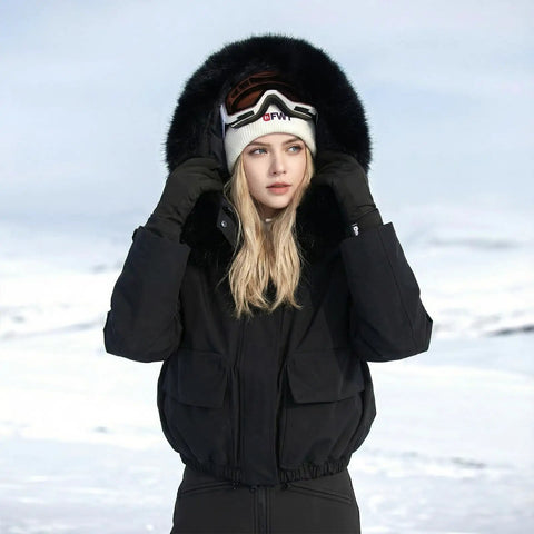 Woman wearing Women's Waterproof Ski Jacket With Windproof Dope Warmth Snowboard Style Snow Coat Short Slim Fit For Hiking All Weather Winter Gear For Cold Slopes And Trails in snowy landscape