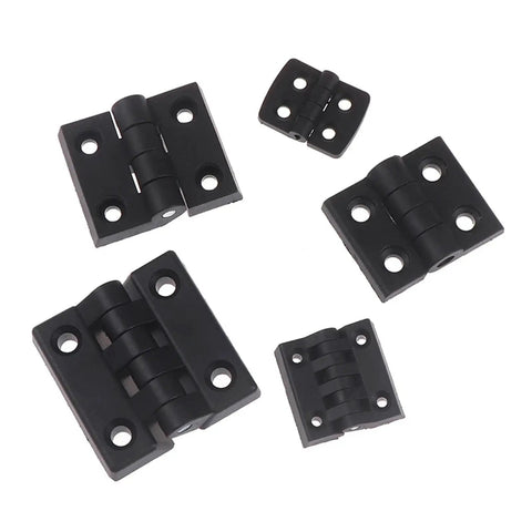Four black plastic rotating concealed door hinges for cabinets and small flat panel doors.