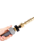 Heavy Duty Brass Garden Hose Shut Off Valve 3/4 Inch One Way Restricted Flow Stop attached to gray hose, hand holding valve