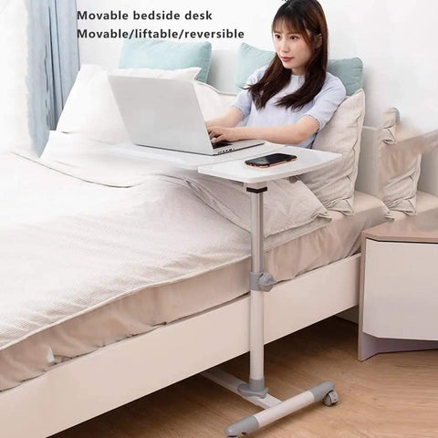 Grab And Go Rolling Sit Stand Desk With Smooth Adjustable Tilt, Portable Standing Lecture Podium For Modern Workspaces, Ergonomic computer console beside a bed with adjustable height.