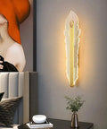 Hella Smooth Game Changing Geometric LED Wall Sconce With Dope Phoenix Tail Design And Acrylic Shade mounted beside gray bed.