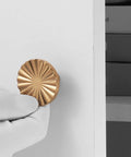Ten Pack Kitchen Cabinet Knobs And Champagne Bronze Drawer Knobs Made From Heavy Duty Zinc Alloy hardware shown from frontal view on a white cabinet.