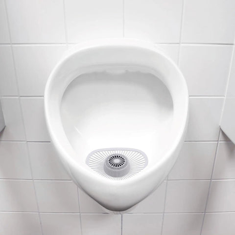 Non Para Green Apple Scent Urinal Screen With Blue Dye Indicator Water Soluble Design in a white urinal