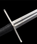 Close-up of the hilt and blade of Beefy Hand Forged Spring Steel Medieval Longsword 46 Inch Full Tang With Black Brown Scabbard Tempered 50 To 55 HRC Real Warrior Sword For Larp Display Or Reenactment.