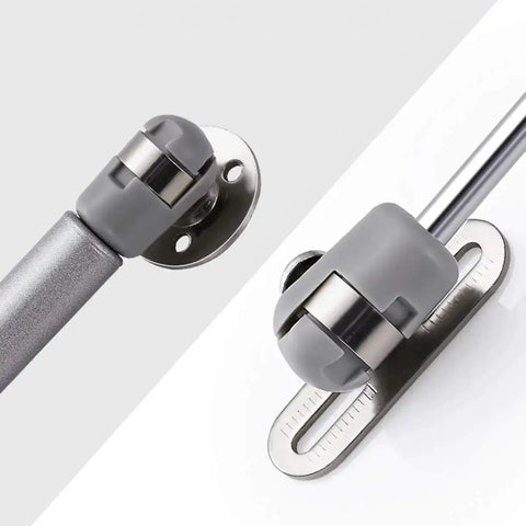 Heavy Duty 10 Inch Gas Spring Strut Lift Support With Brass Cover And Fixing Plate For Cabinet Doors Keeps Box Lids Open Smooth As Butter 60N Silent Glide No Slam Shut Hardware close-up of joint and fixing plate