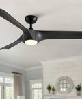 56" Farmhouse Reversible Ceiling Fan Light with Dark Gray ABS Blades, matte black finish, dimmable LED light in living room.
