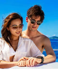 Couple on a boat with man wearing IQ-1204 DC Solar Link Dive Computer With Four Gas Mixes 21 To 100 Percent, solar rechargeable.