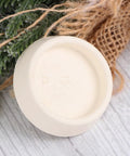 Close-up of a white rubber plug from the 4pcs Rubber Bathtub Stopper Plug with Hanging Ring for Sink Drains, showing the underside.