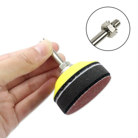Hand holding 2 Inch Drill Sander Attachment With Backer Plate And One Quarter Inch Shank 100 Piece Sanding Discs Pad Kit Includes 80 To 3000 Grit Sandpapers And Sponge Cushion For Fast Polishing And Smooth Finishes On Any Surface.