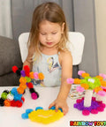 Child playing with Interlocking Gears Kit For Kids With Tote Bag Hands On Fun 100 Colorful Pieces For Sensory Play on table
