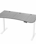 Upgrade Your Workspace With This Slick Dark Gray Standing Desk Measuring Sixty-Three By Thirty-Two Inches. Adjustable height desk with three-piece surface.