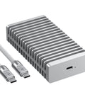 Zero Bottleneck M2 Nvme Enclosure With Slick Aluminum Double Sided Heatsink For Blazing 40Gbps Speeds Compatible With Mac Computers And Windows Featuring One Tb External Drive next to USB-C cables.