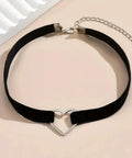 Adjustable Layered Black Necklace For Women With Sleek Dual Chain Design And Polished Alloy Pendant on black velvet with heart detail.