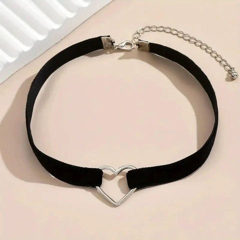 Adjustable Layered Black Necklace For Women With Sleek Dual Chain Design And Polished Alloy Pendant on black velvet with heart detail.