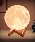 Dope 3D Moon Lamp Upgrade Night Light With 16 LED Colors Wooden Stand Remote And Touch Control USB Rechargeable Large 7 Point 1 Inch Moon Light For Bedroom Living Room Gift glowing on a wooden stand