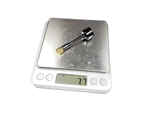 2 Pack Omni FPV Antenna 5.8G RHCP 2.6dBi SMA on digital scale showing 77g