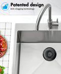 Zero Hassle Kitchen Sink Drain Strainer Featuring A Patent Flip Bottom Design And Sleek Black Chain Mesh Basket in stainless steel sink.