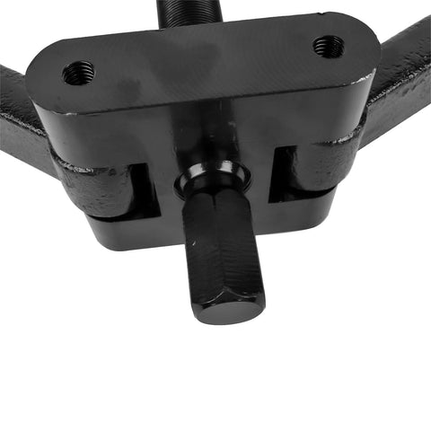 Black lower bearing carrier puller tool with central bolt for removing gearcase bearings in outboard motors.