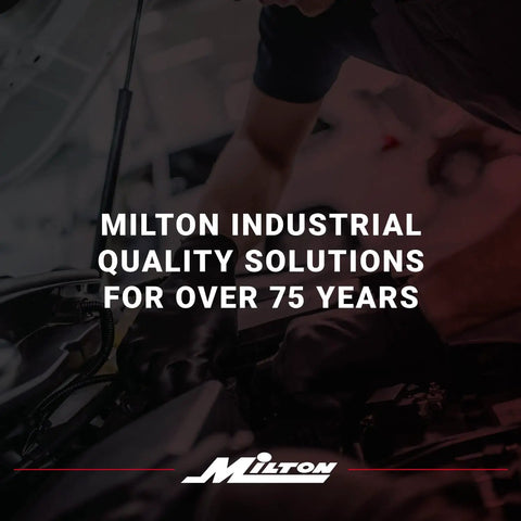 Milton industrial quality solutions text with mechanic working on car engine