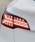 Knight Rider Led Tail Light Upgrade Kit For Model 3 And Model Y showing rear lamps in flame design on a white vehicle.