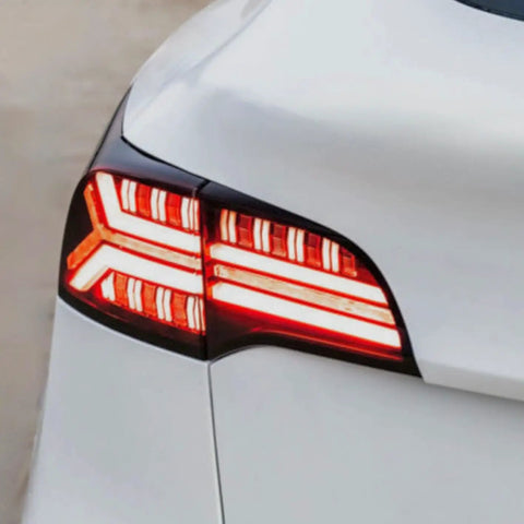 Knight Rider Led Tail Light Upgrade Kit For Model 3 And Model Y showing rear lamps in flame design on a white vehicle.