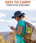Person with backpack carrying 16 Foot Telescopic Stainless Steel Disc Golf Retriever Pole With Hooks And Suction Cup in outdoor setting.