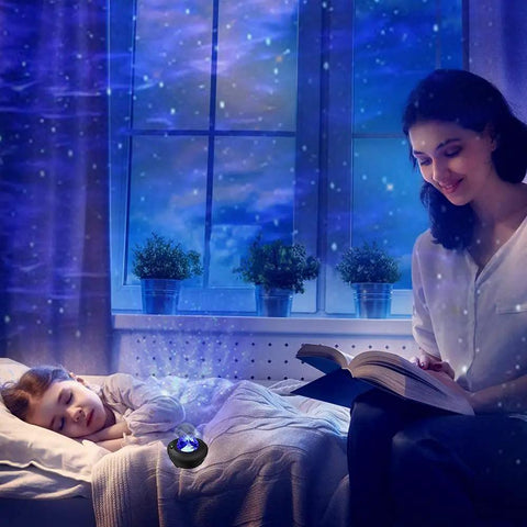 Starry Night Sky Projector For Bedroom With Ocean Wave Light, illuminating a room while a child sleeps and a woman reads.