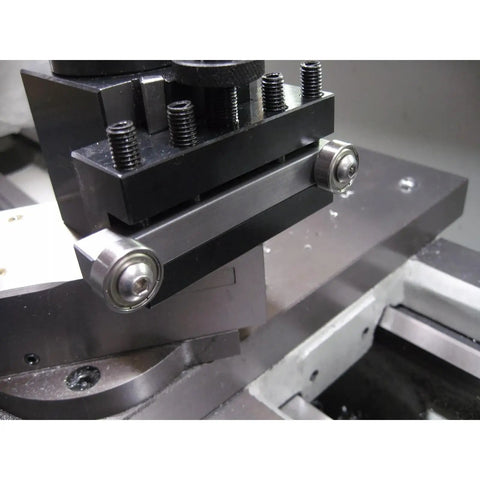 Lathe Centering And Truing Tool With Half Inch Square Tool Head For Centering Short Stock Bump Roller Function, mounted on lathe