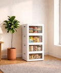 140Qt Stackable Plastic Storage Bins With Lids And Handles, Foldable Closet Organizer With Magnetic Doors And Side Locking in a living room.