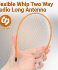 Person holding a flexible orange Dual Band Walkie Talkie Antenna For 144 And 430 MHz With SMA Female Connector, High Gain Soft Whip.