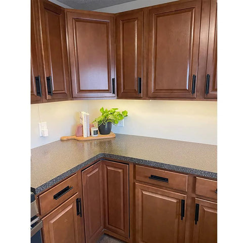 Modern kitchen with brown cabinets fitted with 16 Pack Self Stick Push Pull Helper ABS Plastic Wardrobe Handle For Cabinets And Drawers.