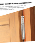 Installed silver piano hinge on wooden cabinet door; long metal hinge with multiple screws