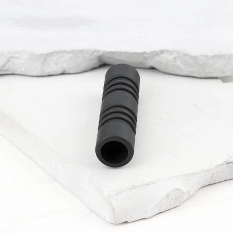 Anti Scald Silicone Steam Wand Sleeve 10mm black, resting on a white textured surface, for most commercial espresso machines