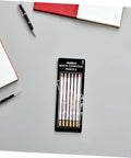Six Piece Sketching Pencils Set for Drawing, Pro Grade Graphite Leads for Artists and Students in packaging on desk