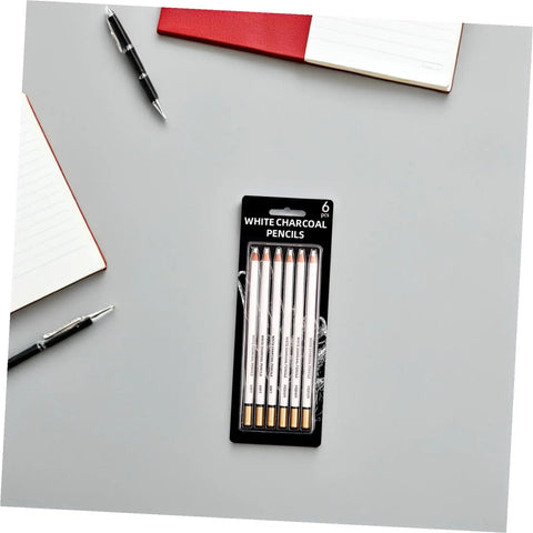 Six Piece Sketching Pencils Set for Drawing, Pro Grade Graphite Leads for Artists and Students in packaging on desk