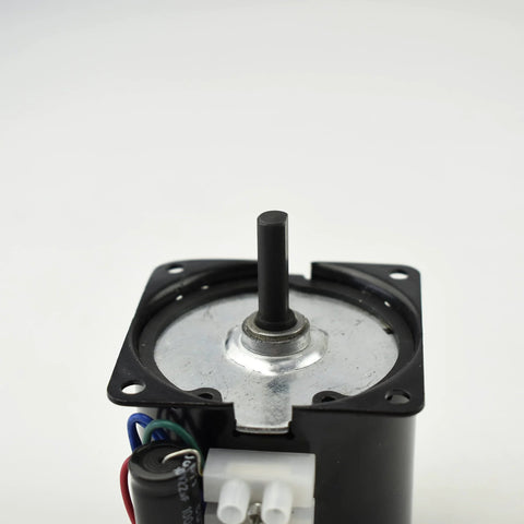 Front view of CHANCS 60KTYZ geared motor with black housing and protruding shaft.