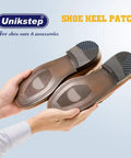 Hands holding shoes with installed Unikstep shoe heel repair patches, featuring anti-slip rubber and sandpaper backing.