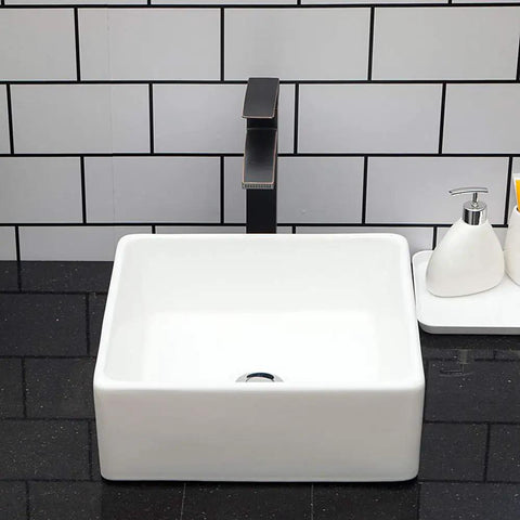 Square Bathroom Vessel Sink Porcelain Ceramic White Vanity Sink Above Counter Modern Sink For Cabinet Lavatory Hotel Style Art Basin Home Washing Basin No Fuss Easy Clean Glaze Finish Sleek Look with black tap and tiled backsplash.