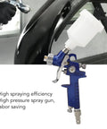Top Shelf HVLP Gravity Feed Paint Sprayer With Sleek Aluminum Body And Point Oh Nozzle For Hella Fine Atomization and Smooth Wide Coverage On Wood Metal And Auto Finish Job, shown in use on a black auto panel.