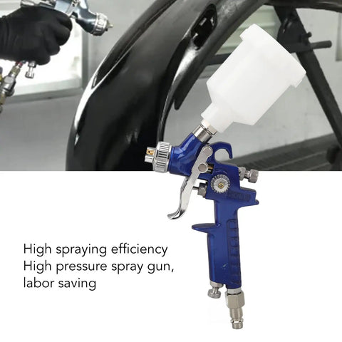Top Shelf HVLP Gravity Feed Paint Sprayer With Sleek Aluminum Body And Point Oh Nozzle For Hella Fine Atomization and Smooth Wide Coverage On Wood Metal And Auto Finish Job, shown in use on a black auto panel.