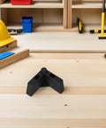 Heavy Duty 4 Pack Adjustable Plastic L Shaped Furniture Legs With M5 Screws on workbench with tools and helmet