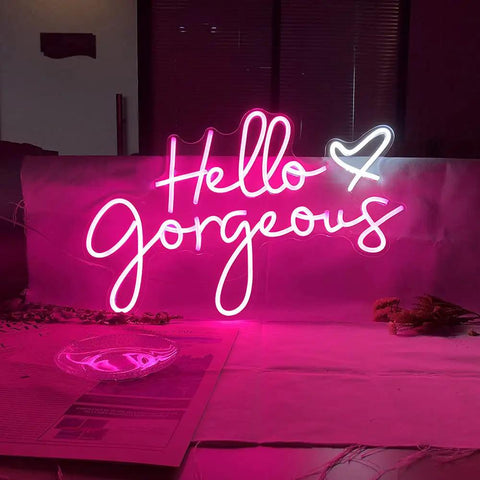 Hello Gorgeous Pink LED Neon Sign For Wall Decor, 21 inch neon light glowing on a wall background for parties.
