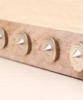 Pro Woodworking Dowel Locator Kit 16 Piece Center Point Dowel Transfer Plugs Set installed on wood plank.