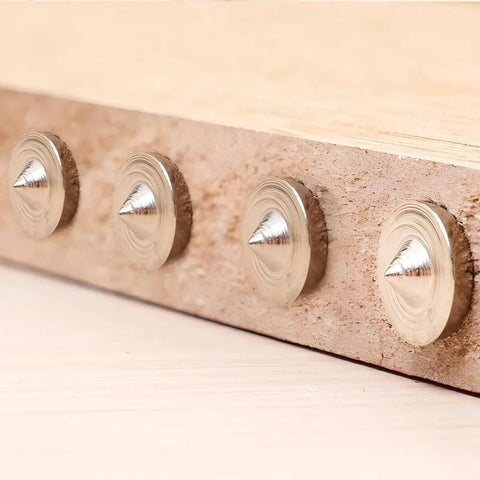 Pro Woodworking Dowel Locator Kit 16 Piece Center Point Dowel Transfer Plugs Set installed on wood plank.