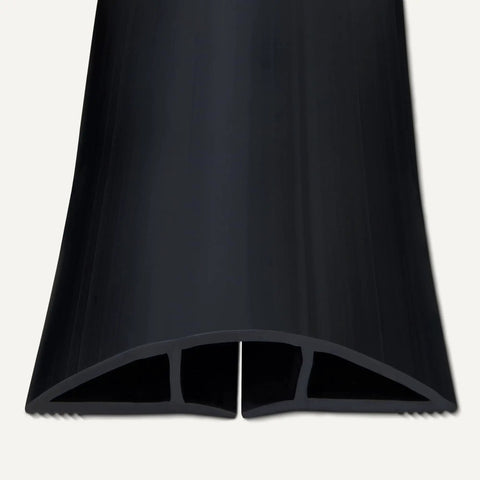 Floor Cord Cover 6 Foot Cable Protector For Wires And Cords Black Low Profile Ramp That Wheels Roll Over Smoothly Keeps Cables Tidy No Trip Hazards Durable Floor Cable Management Solution, black PVC close-up
