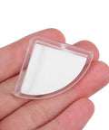 Close-up of a Clear Silicone Corner Protector for Furniture shown in hand, highlighting transparency and size.