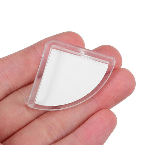 Close-up of a Clear Silicone Corner Protector for Furniture shown in hand, highlighting transparency and size.
