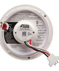 Back view of hardwired smoke detector with 9 volt battery backup for home safety, showing front load battery door and wiring.